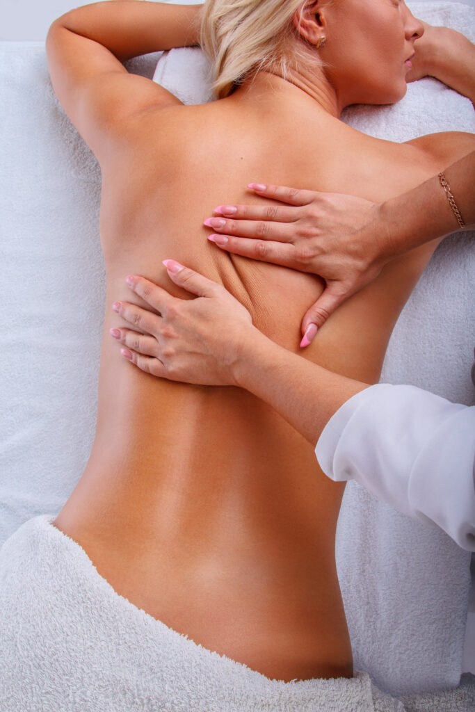 female enjoing relaxing back massage.